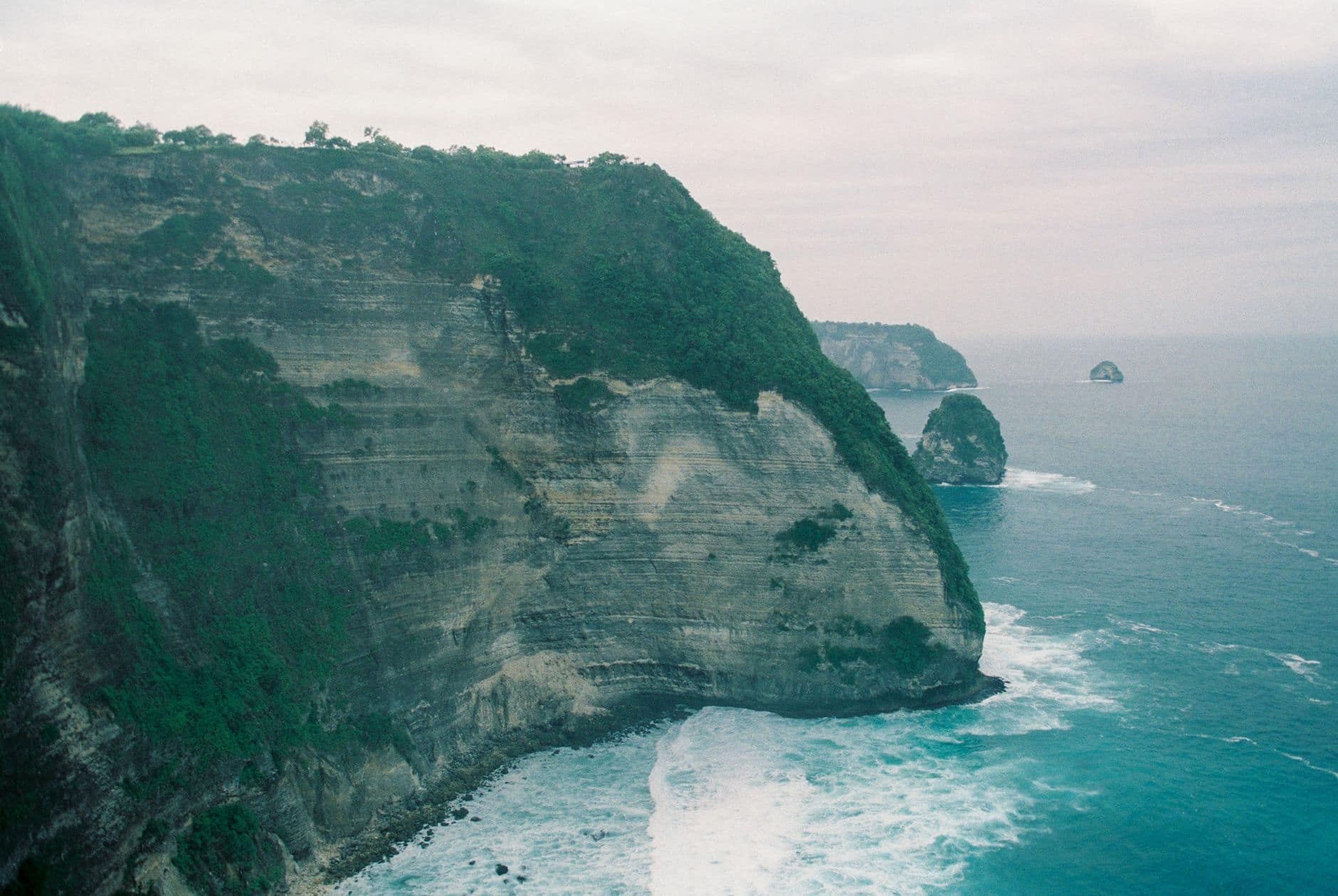 Dramatic cliff coastline of Nusa Penida from above